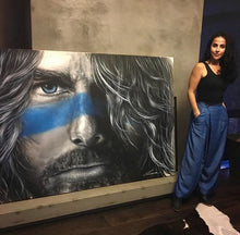 Modern Day Warrior - SOLD  Blk and white portrait of a man, with electric blue stripe across the nose, evoking the intensity of a warriors stare. Painted with mixed medium on a large scale 1.8x1.2m stretched canvas. Inspired by Hollywood actor Tom Cruise.